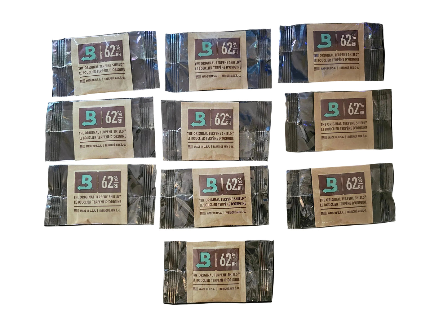 Multiple packages of Biltmore 62% coffee on a black background