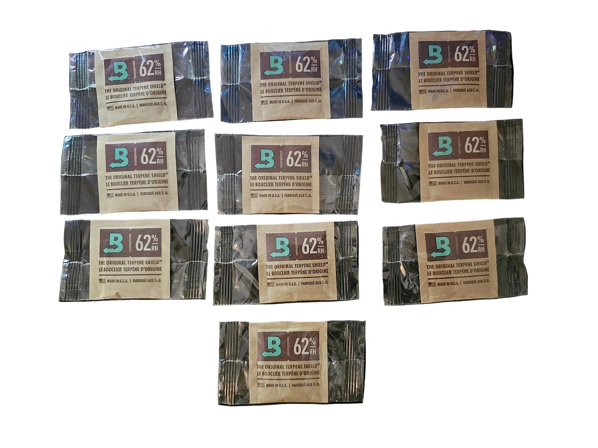 Multiple packages of Biltmore 62% coffee on a black background