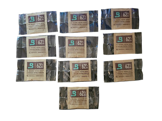 Multiple packages of Biltmore 62% coffee on a black background
